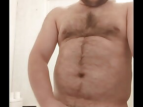 A gay man with tattoos on his pubis and legs staged a hot erotic show!